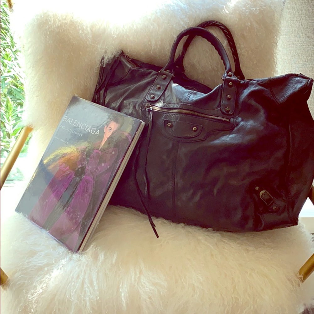 Black Balenciaga Weekender bag.